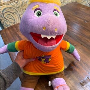Chuck E Cheese Purple Dinosaur Plush Toy with Orange Shirt